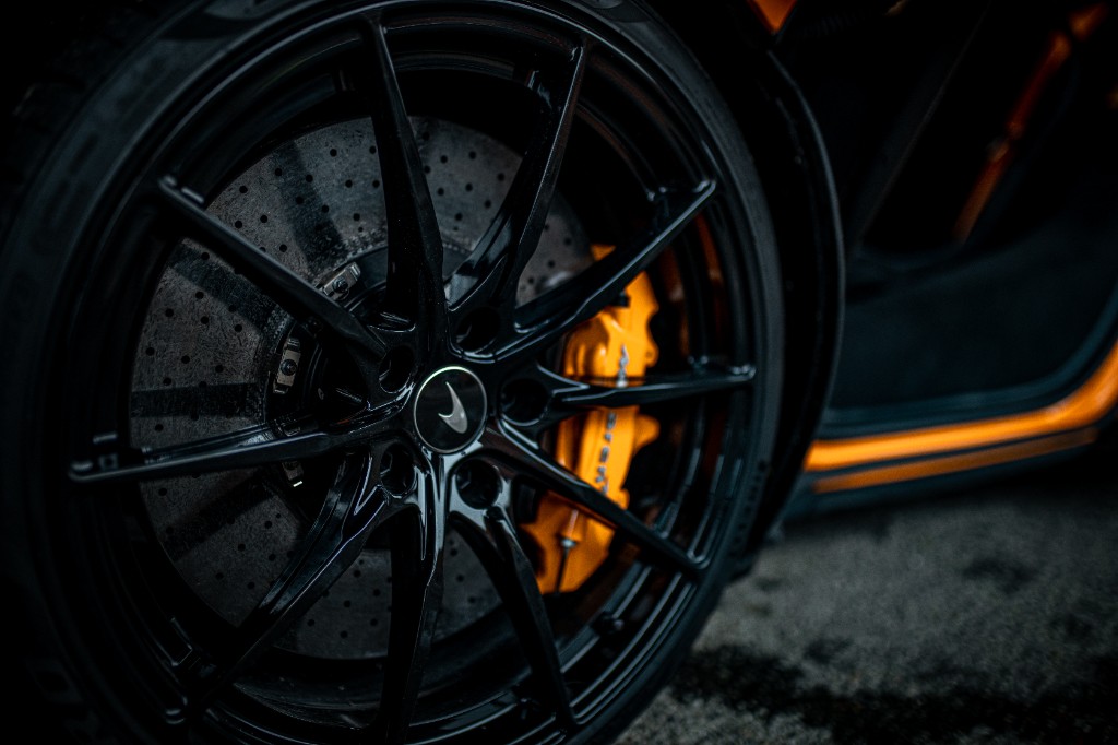 Close-up of McLaren wheel and brake hardware