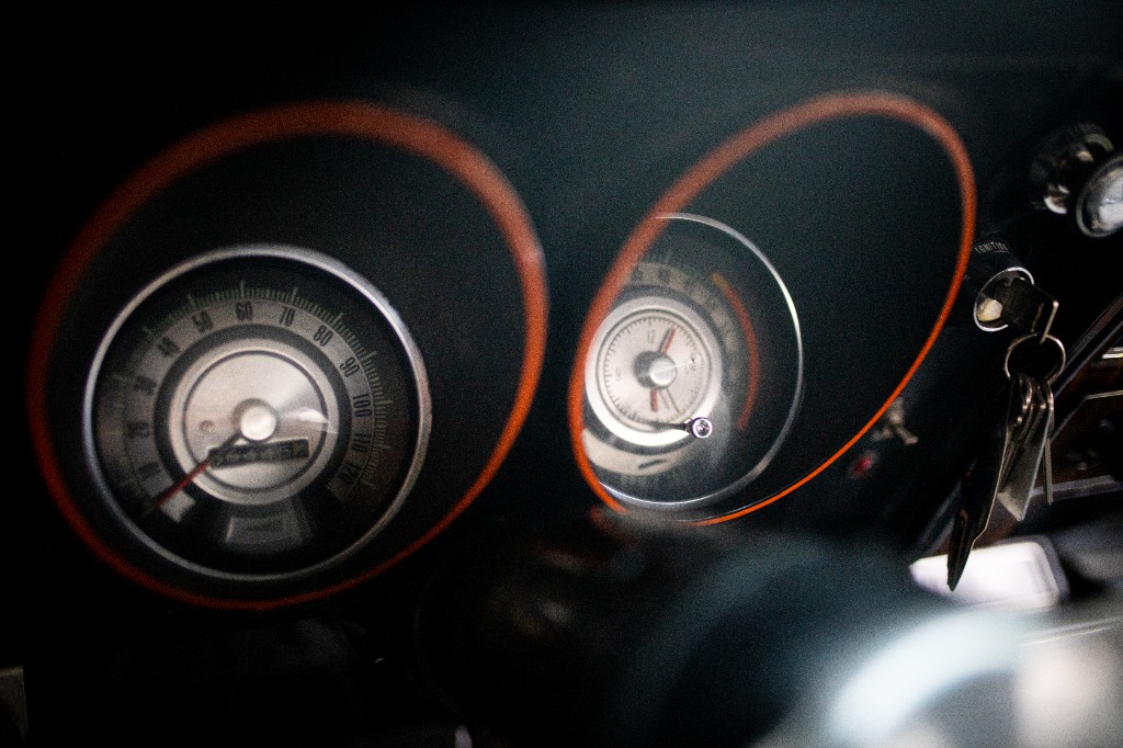 Classic Camaro dashboard with speedometer clock and ignition keys